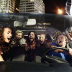 Friends singing in a car Friends singing in a car --- Image by © Josef Lindau/Corbis