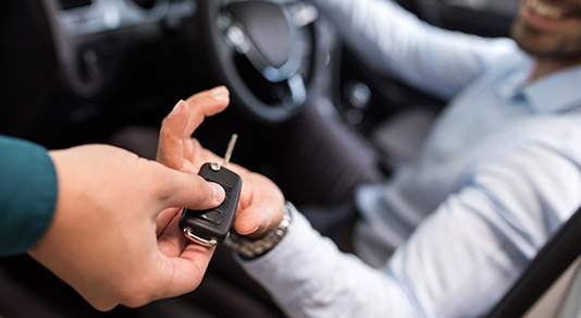 man-receiving-car-keys