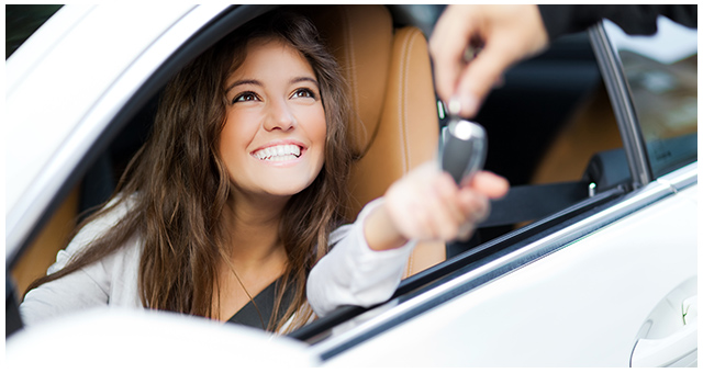 smiling girl reaching for car keys