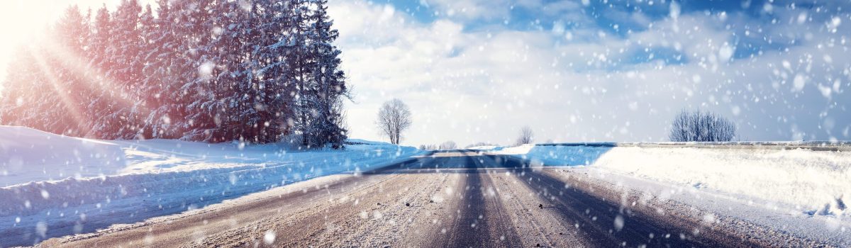 Car on winter road covered with snow