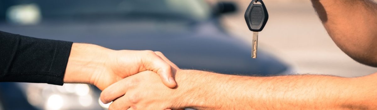 transfer of keys while handshake, car in background