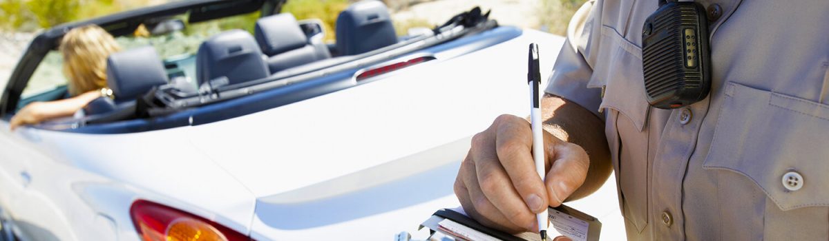 Woman Receiving Speeding Ticket
